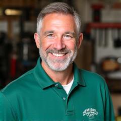 Headshot of John Harrison, a smiling, experienced fishing gear technician in a Northcurrent Outfitters polo shirt.